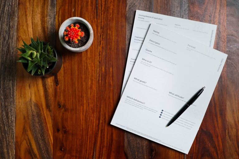 Person holding a rent receipt near a front door with a check and clipboard visible on a small table.