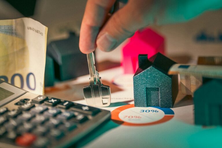 Property owner reviewing rental listings and a home inspection checklist at a kitchen table.